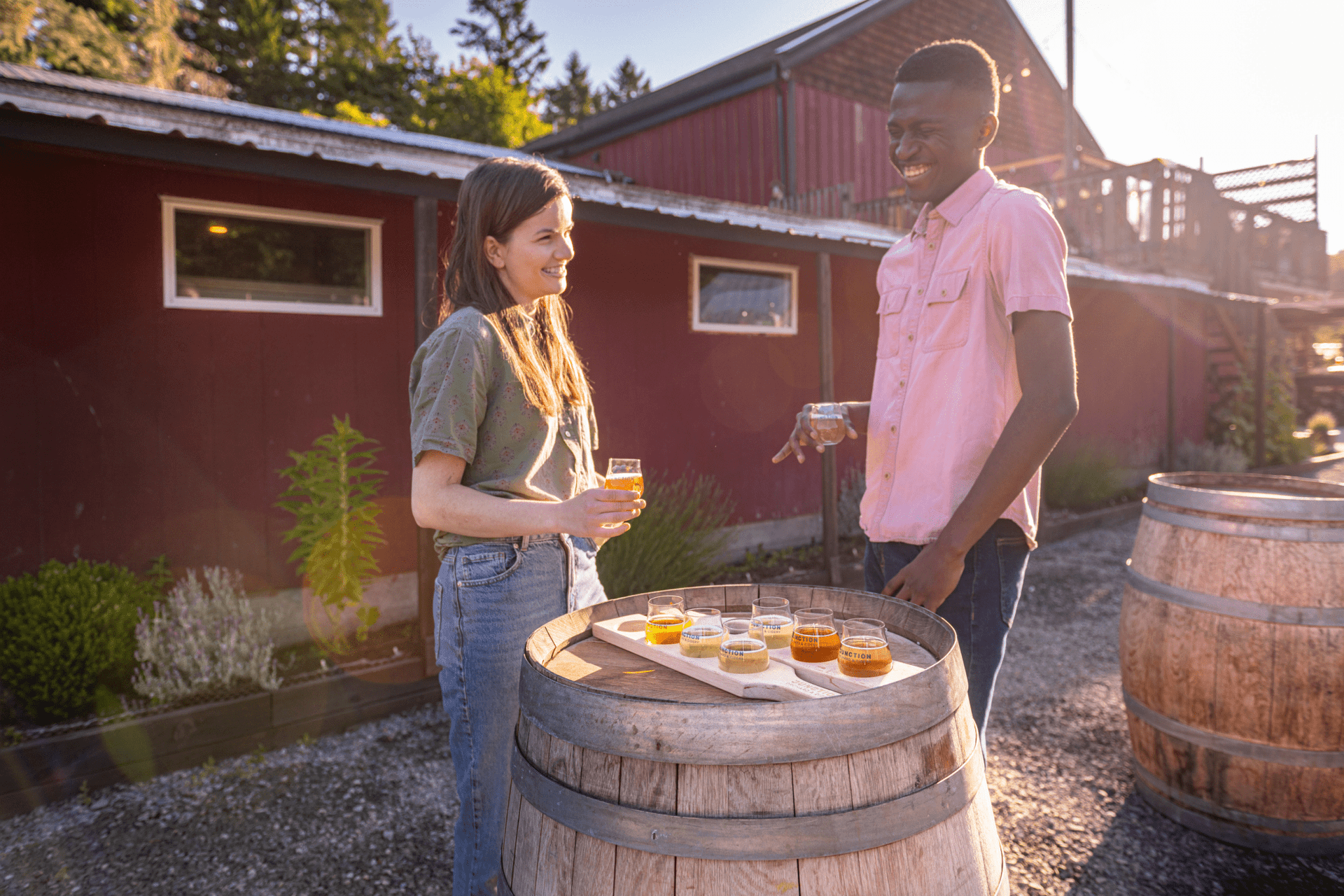 A couple enjoying a cider at a cidery in Victoria, BC